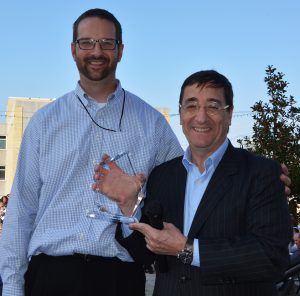 President and CEO Art Tipton, right, presents Tim Ferguson with the President's Award.