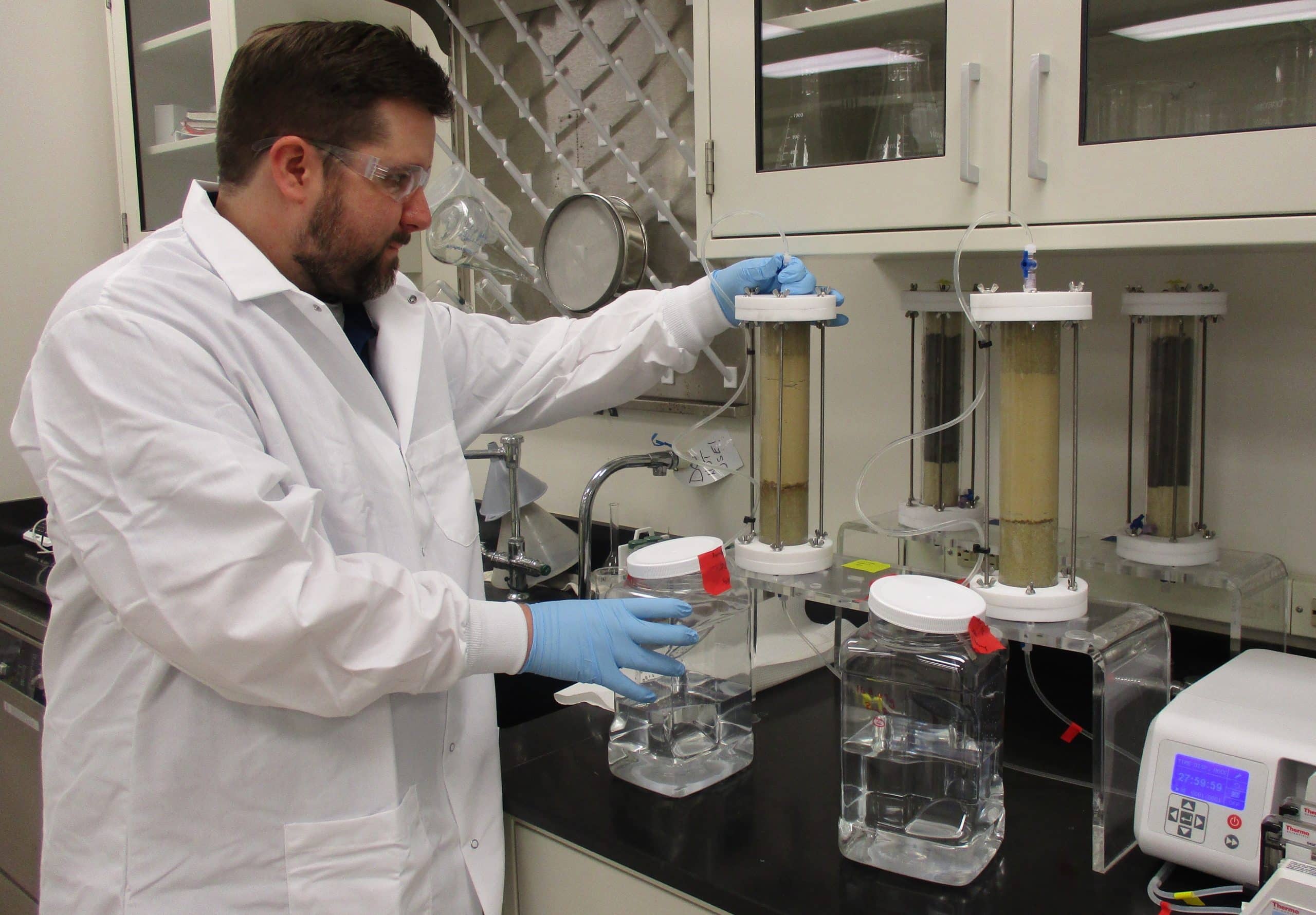 Jay Renew, principal investigator at the Water Research Center, works on column leaching experiments with coal combustion products. Southern Research is working to recover REES from coal combustion products.